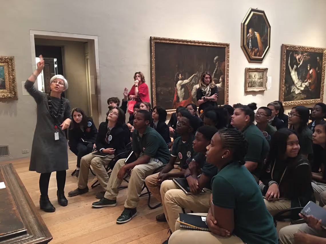 A woman standing in front of a group of people